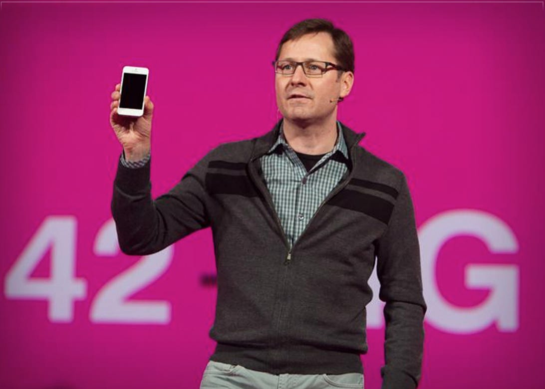 T-Mobile's Chief Marketing Officer Mike Sievert holds aloft the long-awaited T-Mobile iPhone 5 at an event in New York March 26, 2013.
