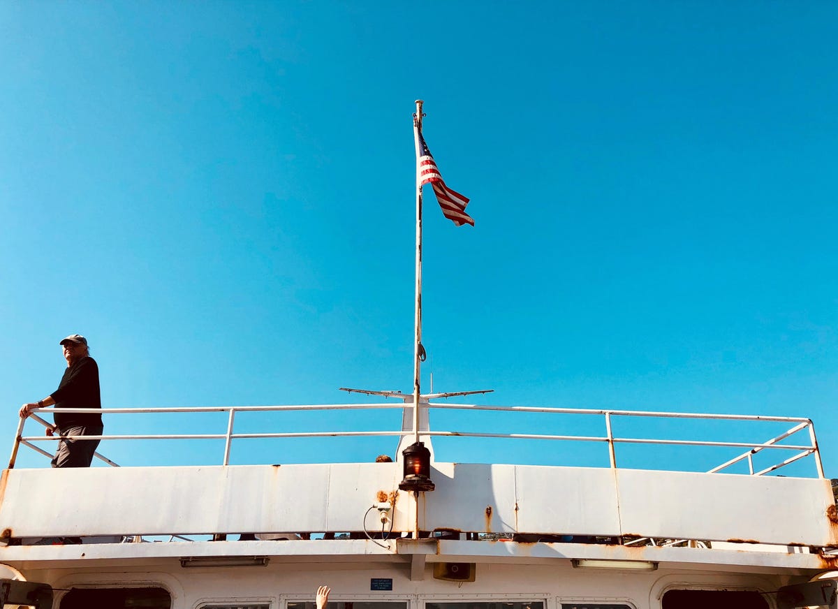 A flag flaps in the wind on the ferry from San Francisco to Angel Island State Park.