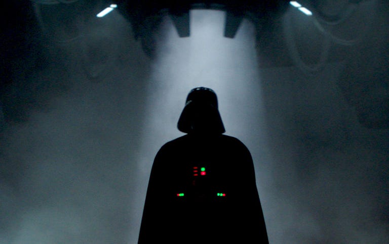 The unmistakable silhouette of black-clad, helmeted bad guy Darth Vader in Obi-Wan Kenobi on Disney Plus.