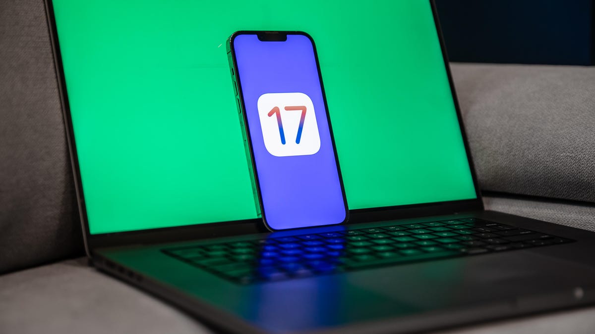 Apple iOS 17 logo on iPhone on green background