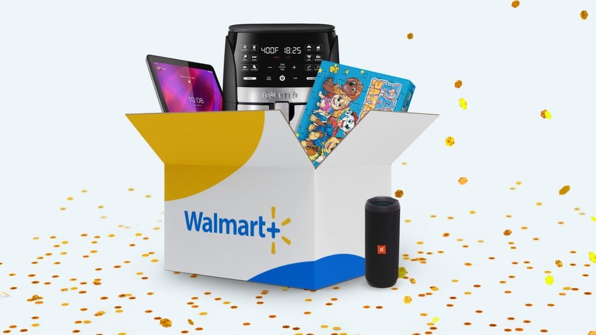 a shipping box with Walmart Plus on the side holds a Paw Patrol puzzle, an air fryer and a tablet device