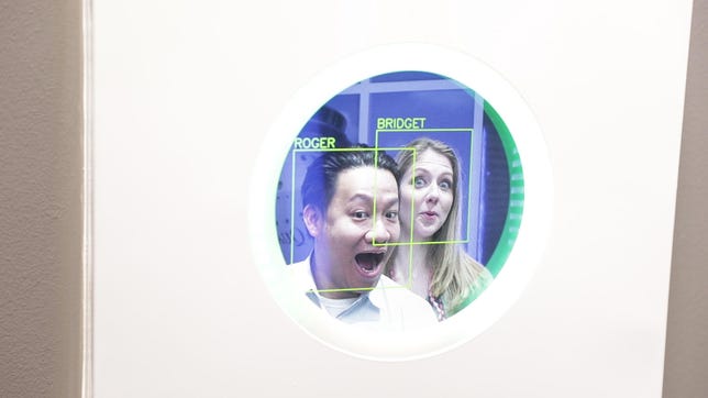 Roger Cheng and Bridget Carey test a facial recognition system.
