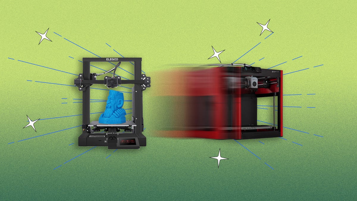 A red 3D printer zooming passed a black one