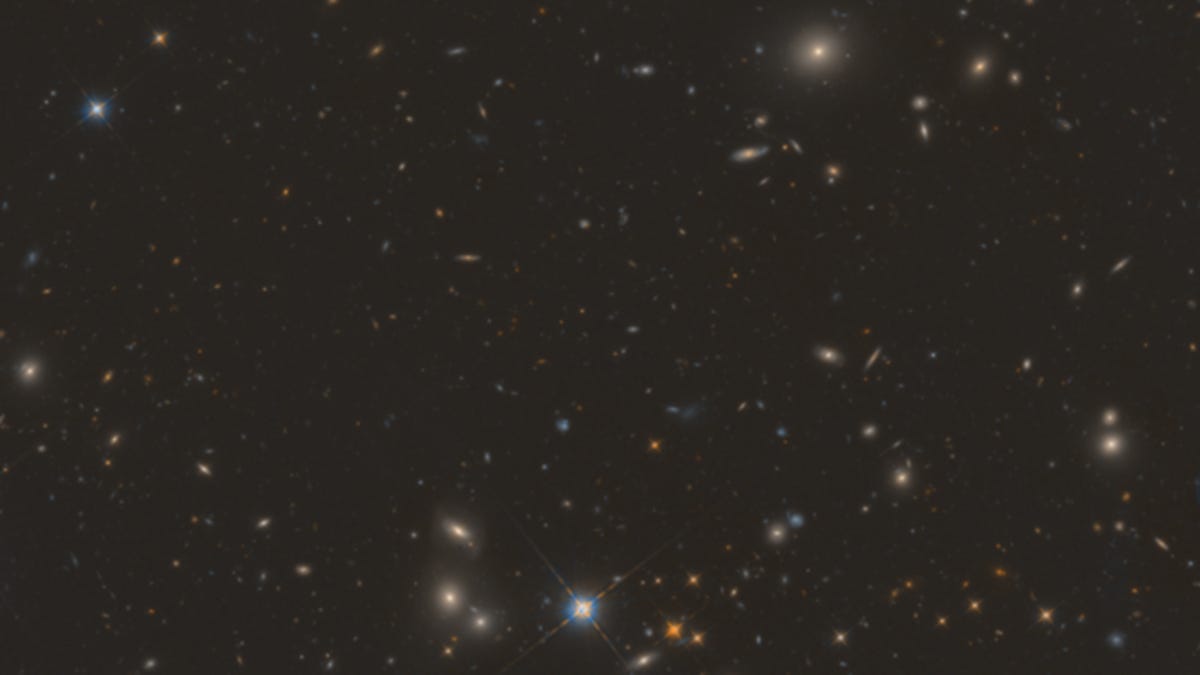 A section of the new image, showing stars and galaxies against a dark sky.