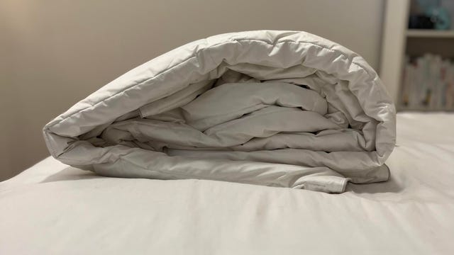 Casper Humidity Fighting Comforter on white bed.