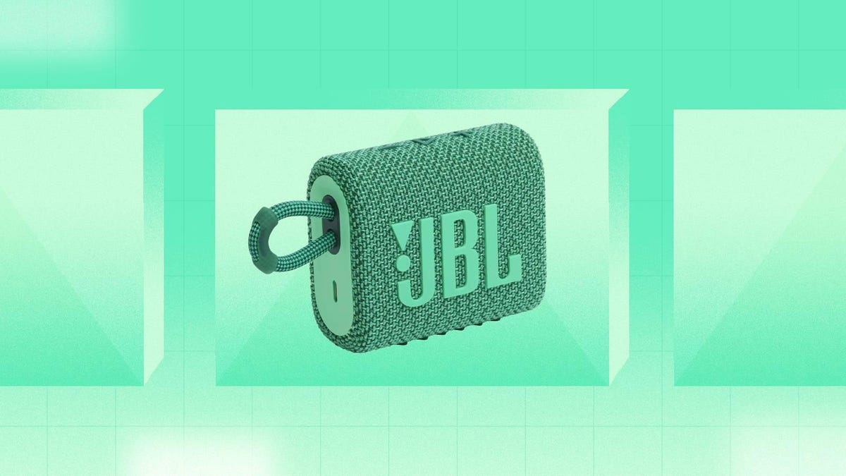 A green JBL Go 3 Eco Bluetooth speaker against a light green background.