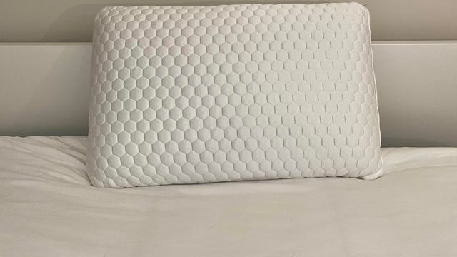 Brooklyn Bedding Cooling Pillow on top of a white bed