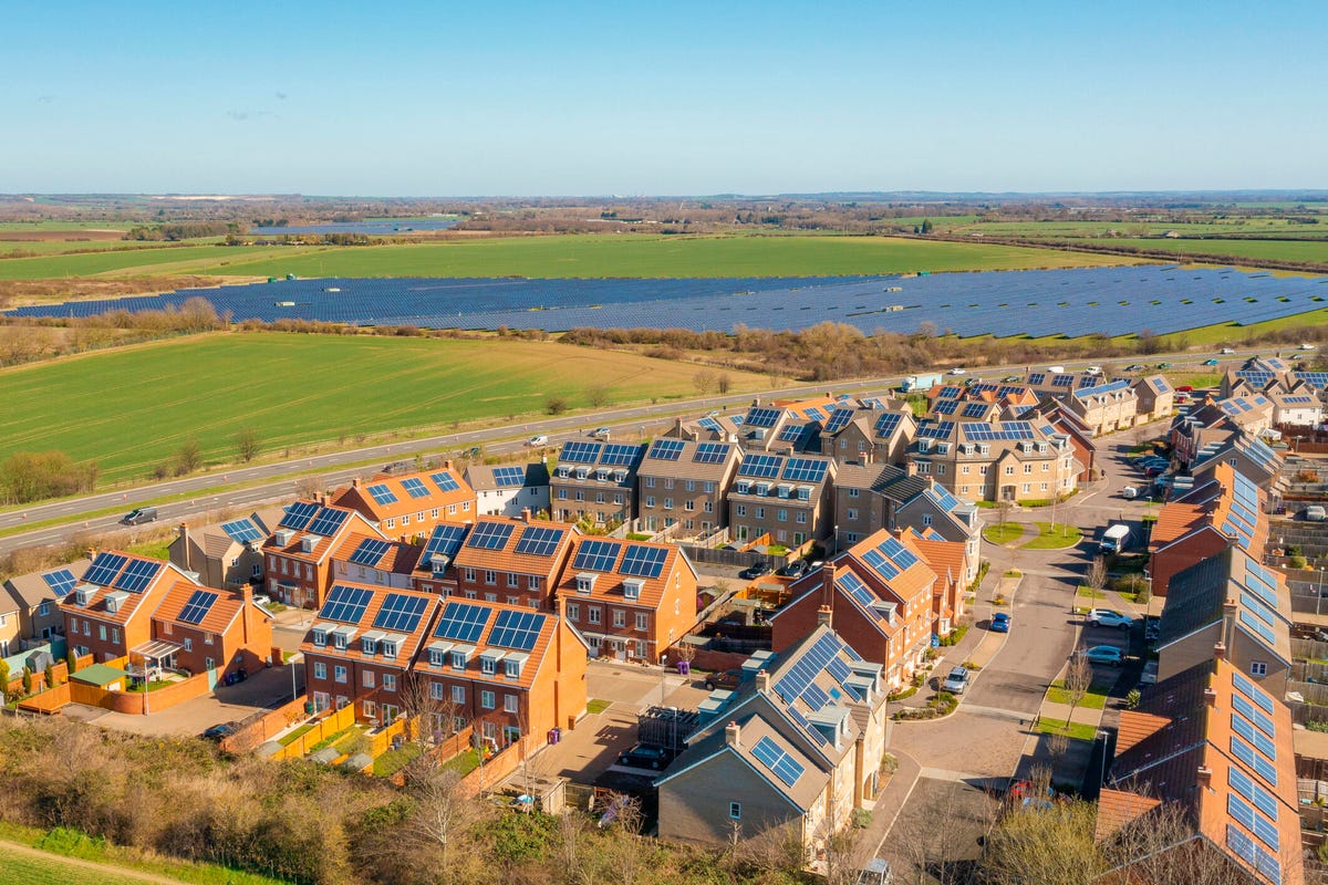 a housing development with rooftop solar panels