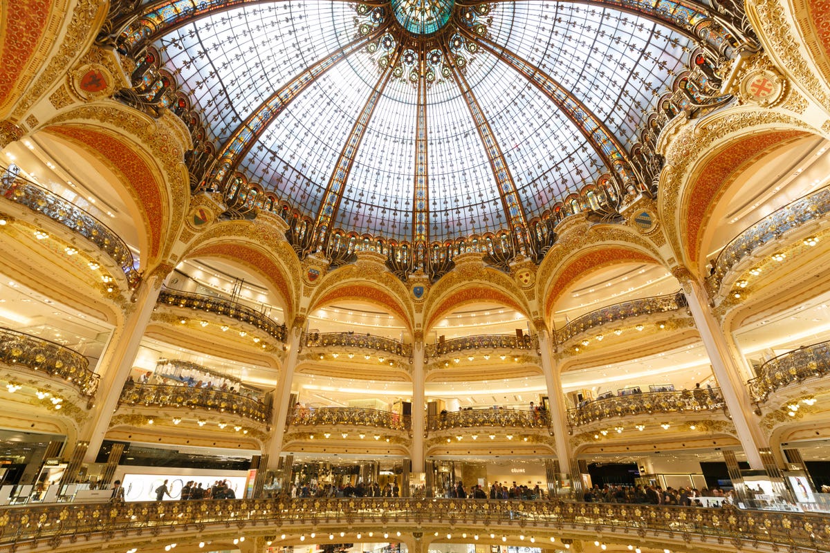 The Apple Watch display at the Galeries Lafayette in Paris occupied prime retail territory: four bays beneath the building's glass atrium.
