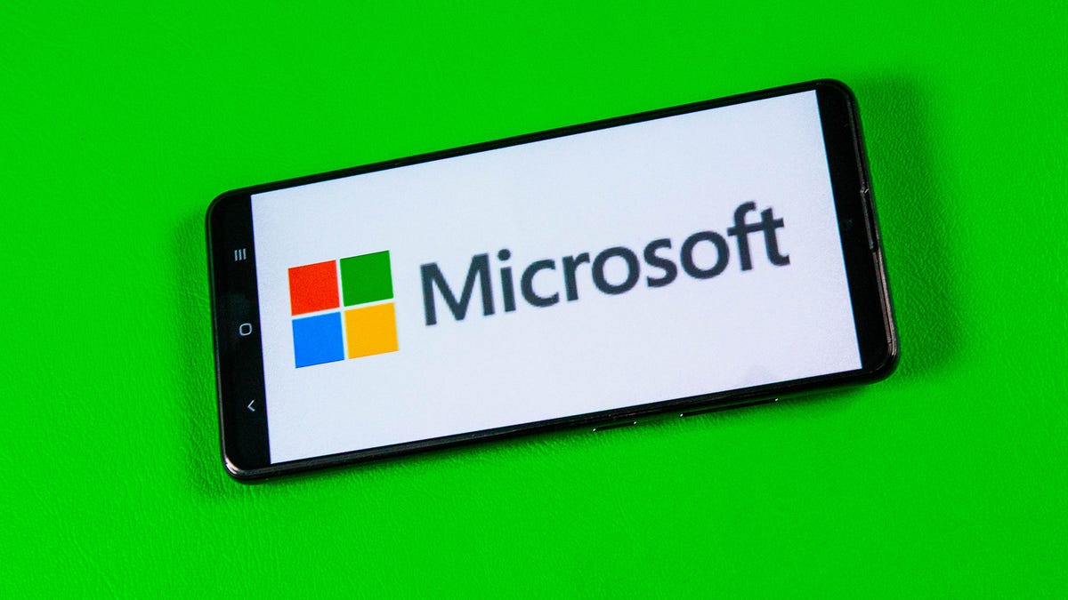 Microsoft logo on a phone screen on green background