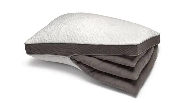 A cross section of the Sleep Number Comfortfit Pillow unzipped and showing three removable inserts.