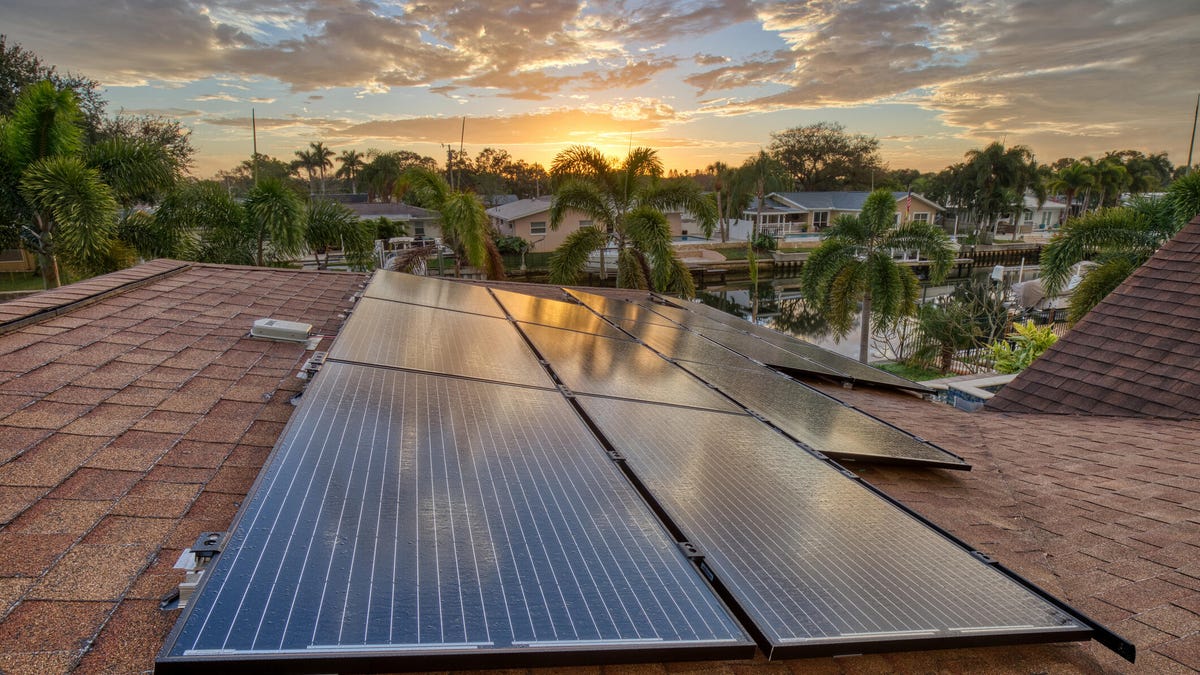 Rooftop solar panels in Florida at sunrise.