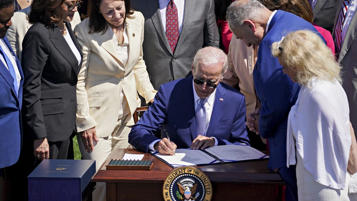 US President Joe Biden signs the Chips and Science Act of 2022 on the South Lawn of the White House in Washington, D.C.