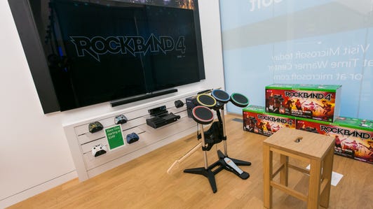 A trademark of nearly every Microsoft store is an area carved out in the front to show off the latest entertainment offering from the Xbox One video game console. The new store's entertainment area will debut with a setup from Rock Band 4.