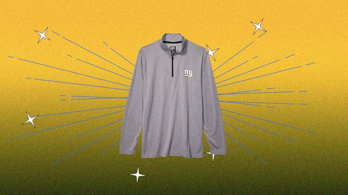 A grey long sleeve shirt with the New York Giants logo against a yellow background.