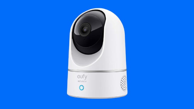 The Eufy C220 indoor cam against a blue background.