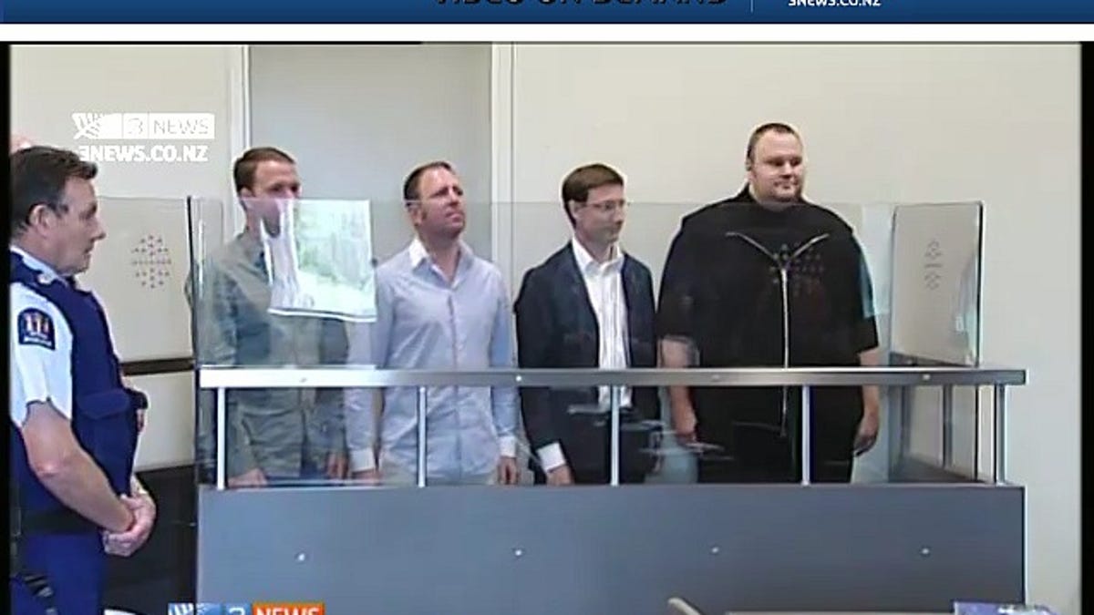Scene from a New Zealand courtroom: Kim DotCom (at right) and others arrested January 19.