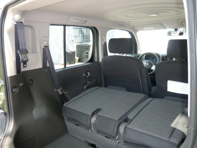 The Cube offers sliding 60/40 fold-flat rear seats and storage in the left C-pillar.