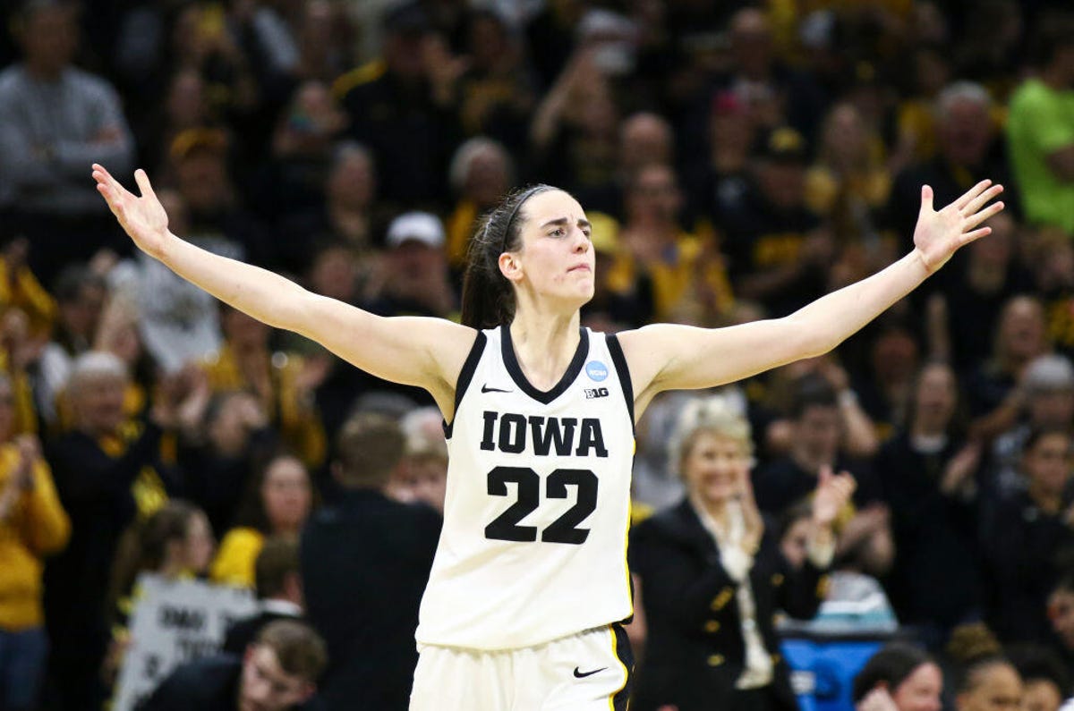 Caitlin Clark of Iowa celebrates another made basket