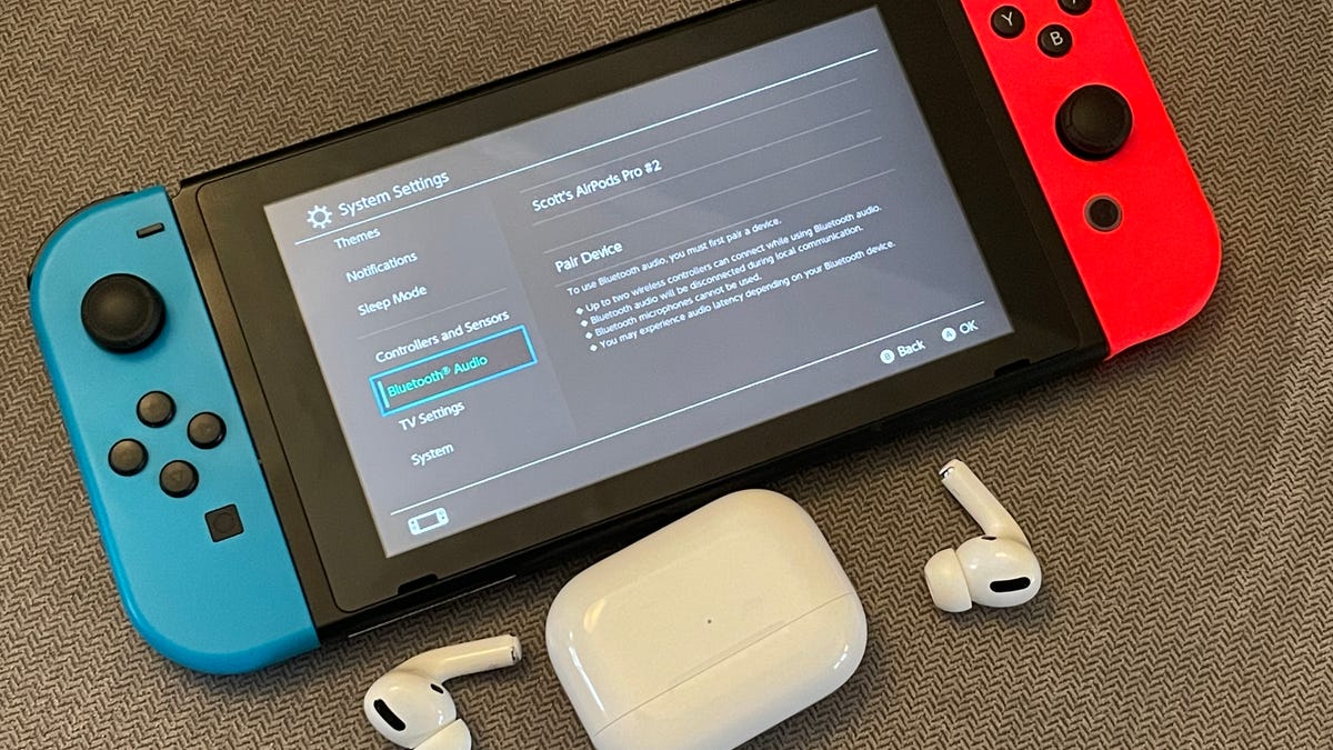 A nintendo switch, a pair of Bluetooth earbuds and the Bluetooth Audio options screen