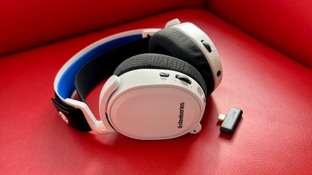 A Steelseries headset against a red background