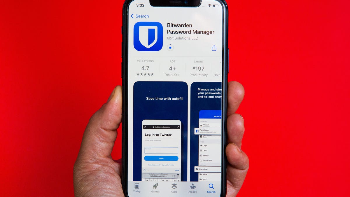 A phone displaying Bitwarden on the iPhone app store