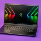 Razer Blade 15 2022 laptop computer on a purple background