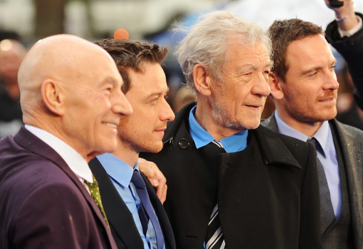 Patrick Stewart, James McAvoy, Ian McKellen and Michael Fassbender smile at a movie premiere.