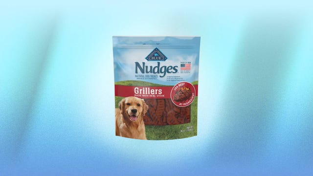 Blue Buffalo dog treats are displayed against a blue background.