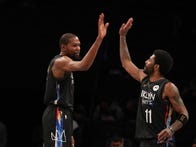 <p>Kevin Durant #7 and Kyrie Irving #11 of the Brooklyn Nets high five during the game against the New Orleans Pelicans.</p>