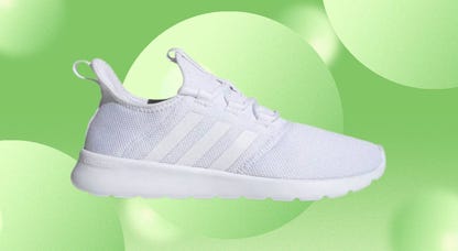 A Cloudfoam Pure 2.0 women's shoe from Adidas is displayed against a green background.
