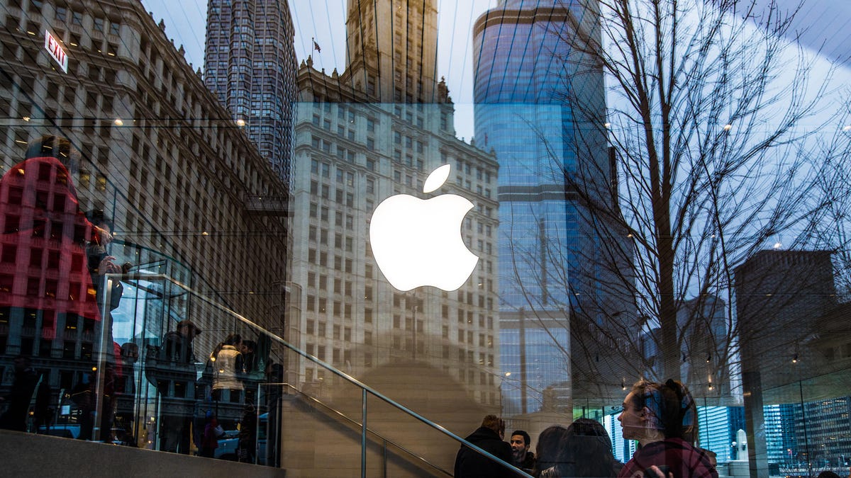 Gorgeous old Chicago buildings reflected in the window of the Apple Store there. Apple's logo is in the center.