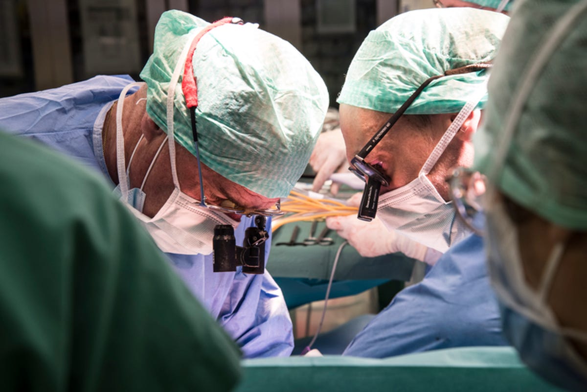 Surgeons working on transplanting the donor liver.
