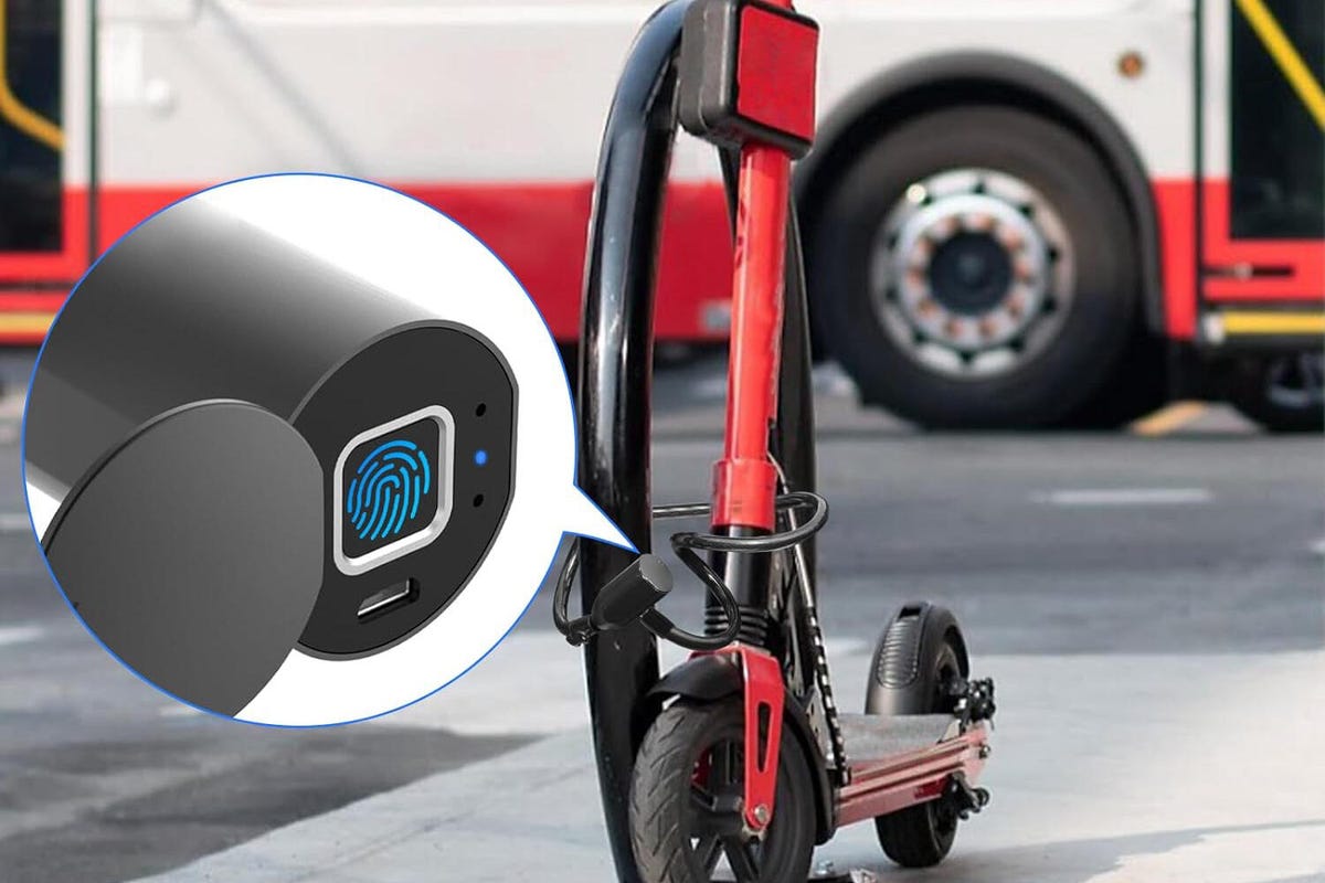 The eLinkSmart lock wrapped around a black bike rack on the street, protecting a red scooter.