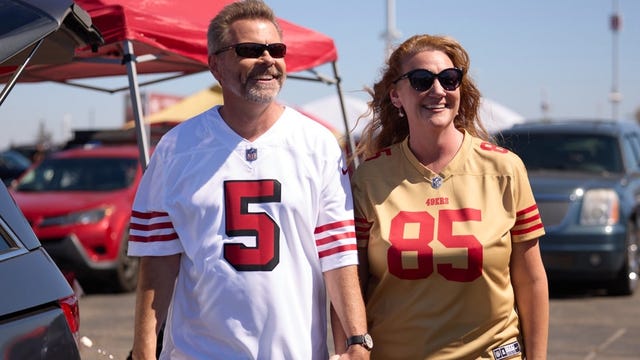 NFL fans wearing 49ers jerseys