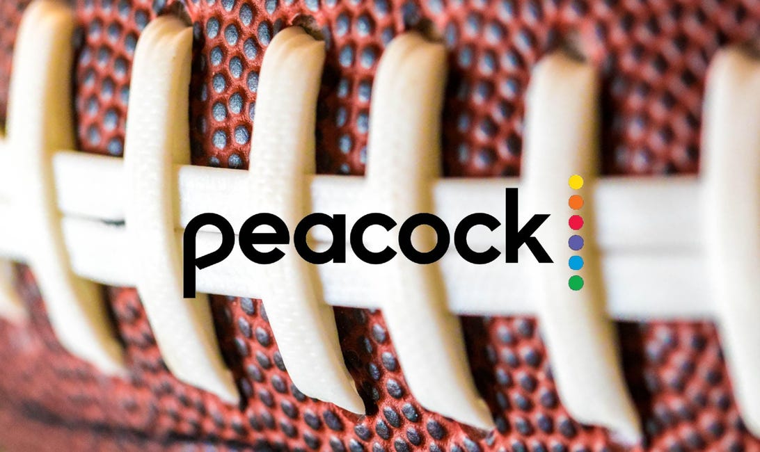 Peacock's logo is set against the white threads of a football closeup.