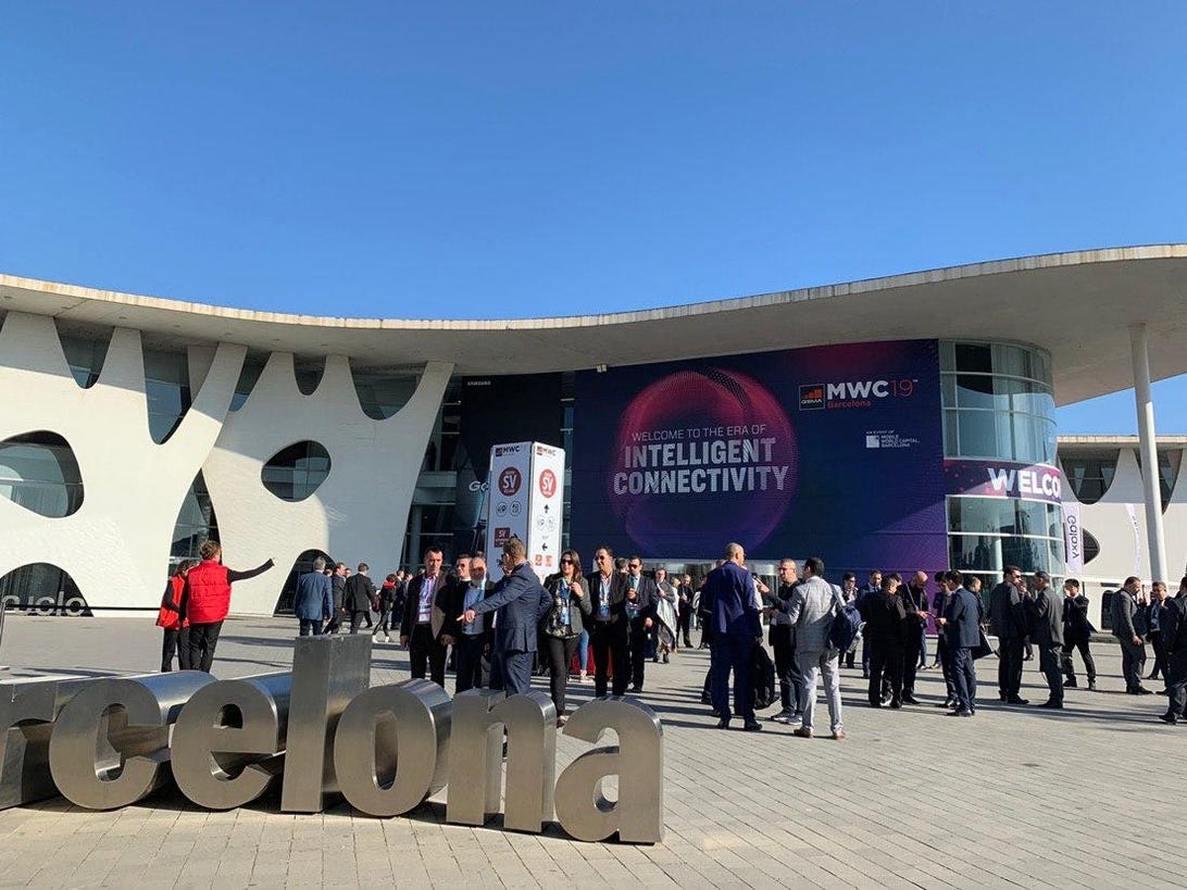 A crowd outside an MWC building in 2019.