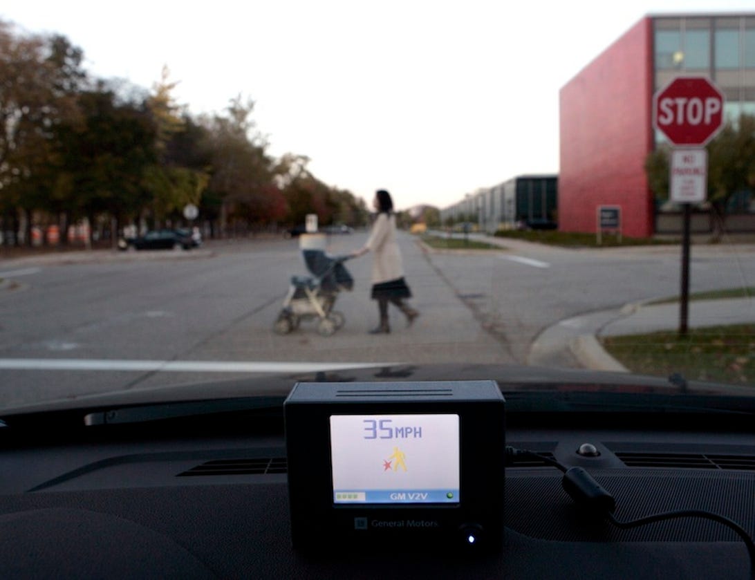 GM's portable vehicle-to-vehicle device can be used by pedestrians to help avoid accidents.